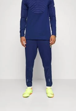 Nike Performance Herren STRIKE PANT WINTERIZED - Jogginghose - Blue Void/volt