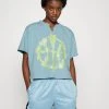 Nike Performance Damen CUTOFF CREW - T-Shirt Print - Worn Blue/atomic Green