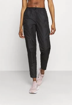 Nike Performance Damen RUN PANT - Jogginghose - Black/gold