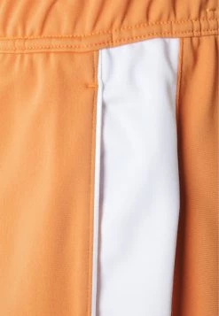 Nike Performance Herren HERITAGE SUIT PANT - Jogginghose - Hot Curry/white -Angebote Nike Store 687b1af54ed4467c830ef37f639f50ee