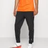 Nike Performance Herren STRIKE PANT WINTERIZED - Jogginghose - Black/total Orange