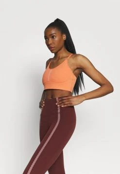Nike Performance Damen INDY EYELET BRA - Sport-BH Mit Leichter Stützkraft - Apricot Agate/arctic Orange -Angebote Nike Store 6db5c8ba764943e6b4b1a90afa415abd