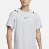 Nike Performance Herren M SS NPC - T-Shirt Print - Light Solar Flare Heather/heather/black