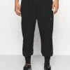 Nike Performance Herren NIKE F.C. CUFF PANT - Jogginghose - Black/white/silver