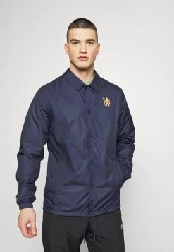 Nike Performance CHELSEA LONDON COACH - Vereinsmannschaften - Blackened Blue/jersey Gold | Herren