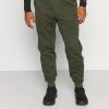 Nike Performance Herren PANT TAPER - Jogginghose - Sequoia/rough Green