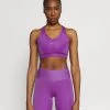 Nike Performance Damen BRA - Sport-BH Mit Mittlerer Stützkraft - Wild Berry/purple Stardust