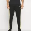 Nike Performance Herren ACADEMY PANT - Jogginghose - Black/saturn Gold/white