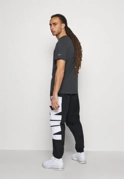 Nike Performance Herren STARTING PANT - Jogginghose - Black/white -Angebote Nike Store fa396727410a494f99c698aee1160e5d
