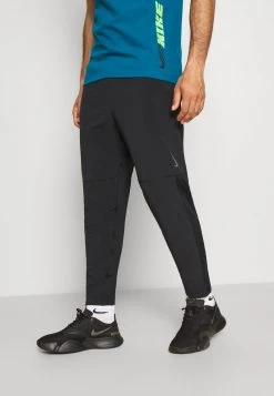 Nike Performance Herren PANT YOGA - Jogginghose - Black/iron Grey